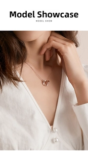 Close-up of rose gold double ring necklace with shimmering pavé set cubic zirconia