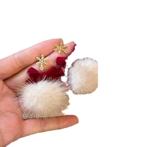 Winter snowflake earrings with red bow and white plush pom poms in golden finish