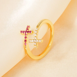 Elegant 18K gold open ring with double cross design featuring pink and clear zircons