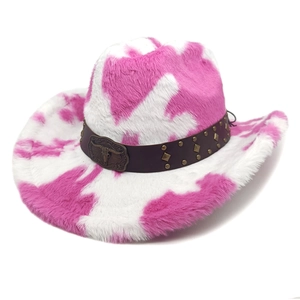 Macro detail of cow print cowboy hat with bull head emblem and studded leather band