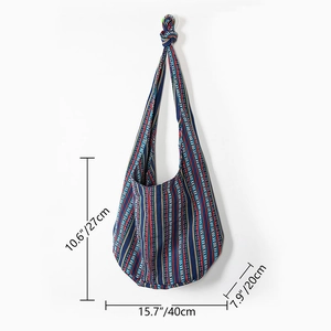 Ethnic striped canvas hobo bag in blue and red with knotted shoulder strap and dimensions