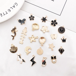 Golden alloy enamel charms set featuring assorted shapes like butterfly, shell and pearls