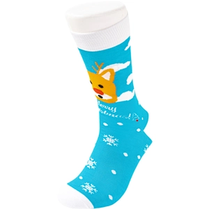 Close-up of blue Christmas socks with white reindeer and snowflake knit patterns