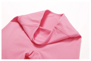 Detail of pink high-waisted yoga leggings with premium flatlock stitching and elastic fabric