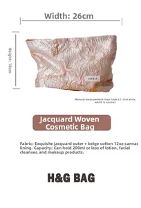 Detail view of floral jacquard makeup bag showing 26x18cm dimensions and texture
