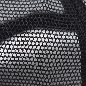 Close-up of high-quality black breathable mesh fabric with honeycomb knit for baseball caps
