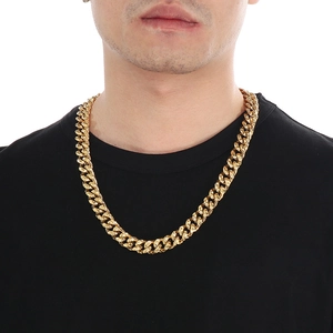 Men's hammered texture Cuban link chain necklace in gold finish on male model