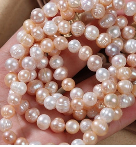 Detailed macro view of 7-9mm natural freshwater pearls in pink and lavender pastel colors
