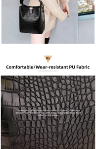 Detail of black crocodile texture PU leather handbag with metallic buckle close-up view
