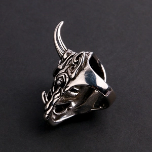 Macro detail of gothic dragon head ring with antique finish and intricate scale textures