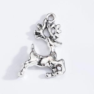 Macro view of silver reindeer charm pendant made of alloy for Christmas DIY jewelry