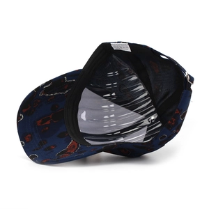 Detail of printed baseball cap showing 100% polyester wash label and inner structure