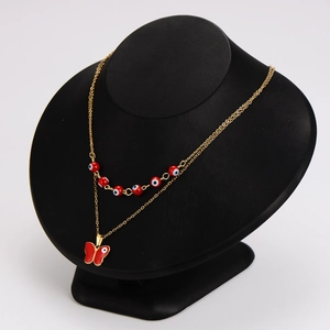 Golden double-layer stainless steel necklace featuring red evil eye and butterfly pendant