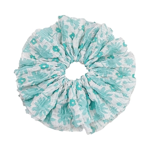 Oversized white floral scrunchie with turquoise flower print and pleated fabric texture