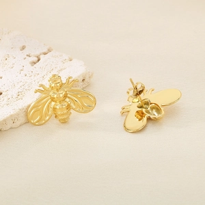 Minimalist gold bee stud earrings for women with detailed insect wings on a stone base
