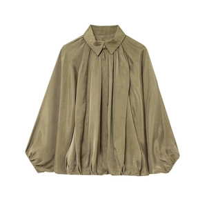 Detail of army green bomber jacket featuring pleated sleeves and satin fabric texture