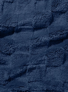 Macro detail of the premium dark blue faux fur lining with soft and thick plush texture