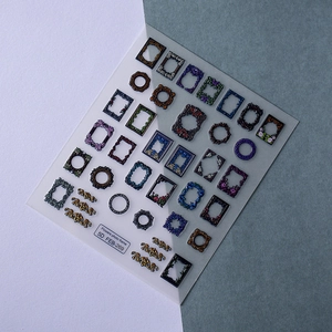 Close-up of 5D embossed nail stickers featuring vintage floral photo frame designs