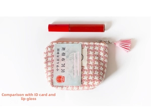 Pink and white checkered tweed coin purse with decorative tassel and zipper closure