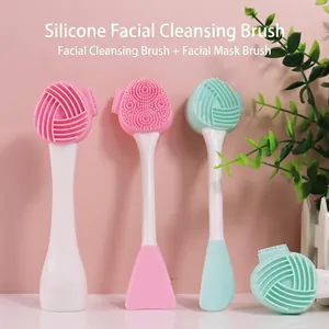 Dual-ended silicone facial cleansing brush and mask applicator in pink and mint green