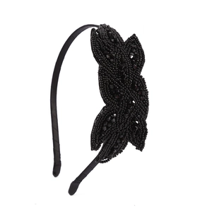 Detail of bohemian handmade black beaded headband with crystals and leaf pattern