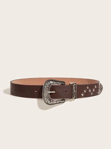 Detail of dark brown leather belt with vintage silver star studs and carved metal buckle