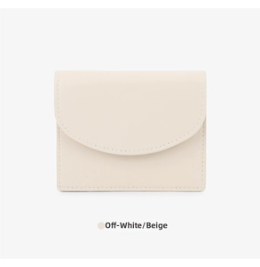 Close-up of beige minimalist card holder featuring fine stitching and curved flap detail