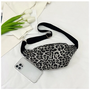 Detail of leopard print crossbody bag with adjustable nylon strap and metal buckle