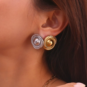 Retro twisted rope button stud earrings in 18K gold and silver plating on model