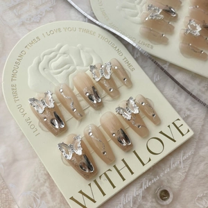 Handmade gradient nude press-on nails with 3D silver butterfly and rhinestone accents