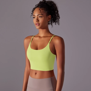 Close-up of fluorescent green sports bra with thin straps and high-stretch nylon fabric