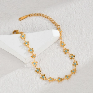 Bohemian style 18K gold plated stainless steel bracelet with blue floral charms and lobster clasp