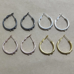 Set of four minimalist hoop earrings in gold silver and rose gold with rhinestone inlay