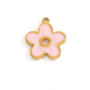 Close-up of gold 18K plated floral pendant with pink marble enamel inlay detail