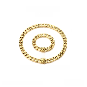 Detail view of 13mm gold stainless steel Cuban link necklace and bracelet set with box clasp