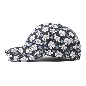 Black cotton baseball cap featuring light blue floral hibiscus print with curved brim