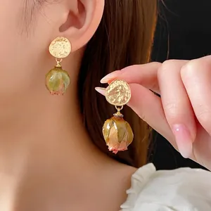 French vintage preserved rose bud earrings with gold hammered studs and resin finish