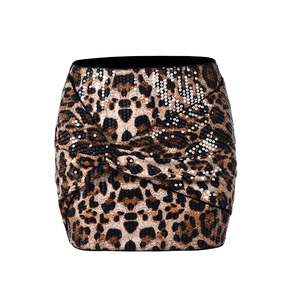 Detail shot of leopard print sequins and cross knot design on the mini bodycon skirt