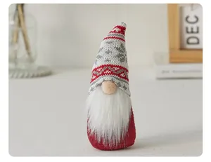 Close-up of a Christmas gnome featuring a knitted snowflake hat and plush white beard