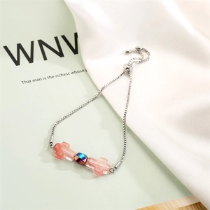 Detail of adjustable stainless steel chain with pink cross charms and iridescent beads