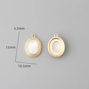 Detail view of 18k gold plated oval shell charms with 15mm by 10.5mm size specifications