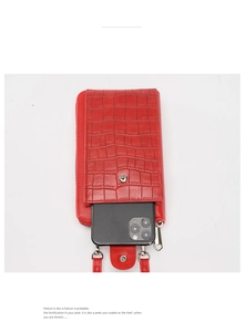 Detail view of red crocodile textured PU leather phone bag with metal zipper and snap closure