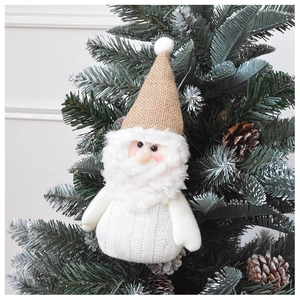 Plush Santa and elf ornament with knitted and linen texture hanging on a Christmas tree