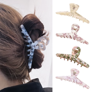 Large acetate hair claws in four colors including blue, beige, pink and green variants