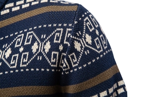 Detailed view of the navy blue knit shoulder with brown stripes and geometric jacquard patterns