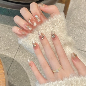 Elegant long coffin press-on nails with silver cat-eye effect, pearls and 3D rhinestones
