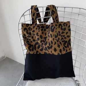 Detail of leopard print corduroy and black fabric patchwork on large tote bag