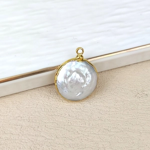 Close-up of a white baroque pearl pendant with gold plating for DIY jewelry making