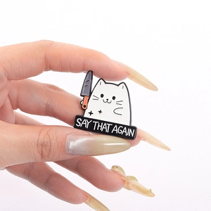 Funny cartoon cat enamel pin holding a knife with Say That Again text for backpacks