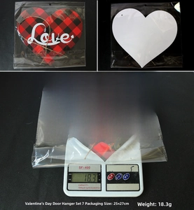 Detail of red and black buffalo plaid heart door sign with Love text and weight scale